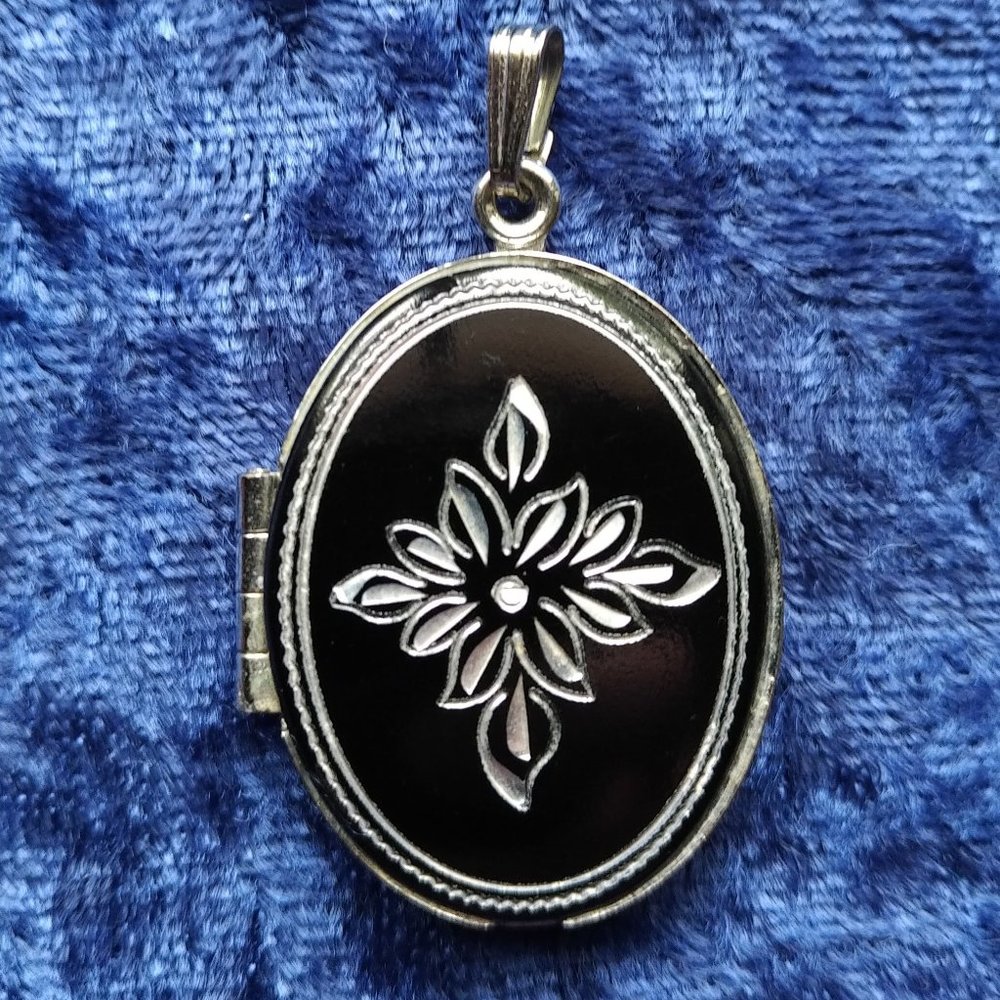 Black and silver locket